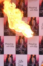 KATIE PRICE Fire Breathing at Her New Book Playing with Fire Photocall in London 01/17/2017