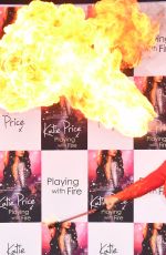 KATIE PRICE Fire Breathing at Her New Book Playing with Fire Photocall in London 01/17/2017