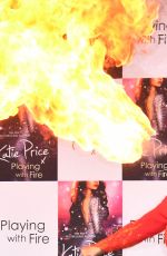 KATIE PRICE Fire Breathing at Her New Book Playing with Fire Photocall in London 01/17/2017