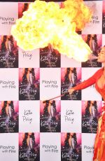 KATIE PRICE Fire Breathing at Her New Book Playing with Fire Photocall in London 01/17/2017
