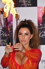 KATIE PRICE Fire Breathing at Her New Book Playing with Fire Photocall in London 01/17/2017