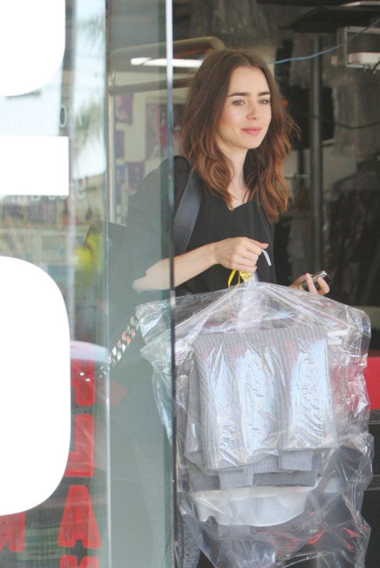 LILY COLLINS Getting Up Her Dry Cleaning in West Hollywood 10/11/2017