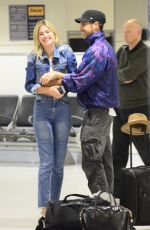 MEGAN BLAKE IRWIN and Nicolo Knows Kissing at Sydney Airport 10/19/2017
