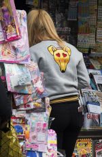 MICHELLE HUNZIKER Buys Newspapers in Bergamo 09/30/2017