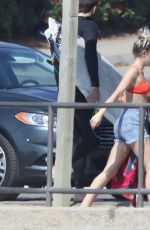 MILEY CYRUS in Bikini Top and Denim Shorts at a Beach in Malibu 10/16/2017