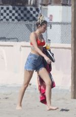 MILEY CYRUS in Bikini Top and Denim Shorts at a Beach in Malibu 10/16/2017