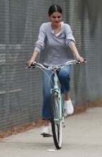 SELENA GOMEZ Out Riding a Bike After Splitting from The Weeknd in Los Angeles 10/30/2017