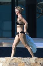 CHARLIZE THERON in Bikini on the Beach in Los Cabos 11/23/2017