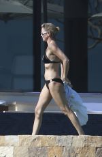 CHARLIZE THERON in Bikini on the Beach in Los Cabos 11/23/2017