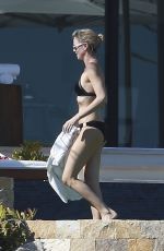 CHARLIZE THERON in Bikini on the Beach in Los Cabos 11/23/2017
