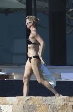 CHARLIZE THERON in Bikini on the Beach in Los Cabos 11/23/2017