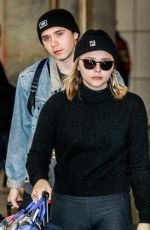 CHLOE MORETZ and Brooklyn Beckham at JFK Airport in New York 11/27/2017