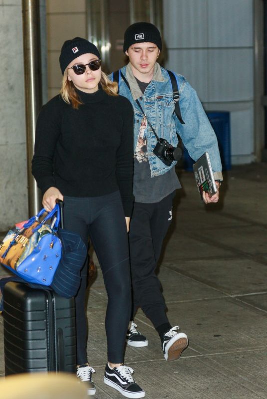 CHLOE MORETZ and Brooklyn Beckham at JFK Airport in New York 11/27/2017