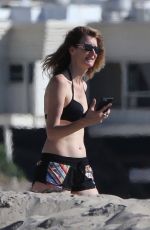 LAURA DERN in Bikini Top and Shorts at a Beach in Malibu 11/22/2017