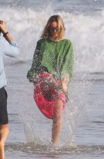 MARGOT ROBBIE on the Set of a Christmas Photoshoot at a Beach in Malibu 11/08/2017
