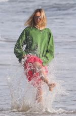 MARGOT ROBBIE on the Set of a Christmas Photoshoot at a Beach in Malibu 11/08/2017