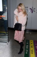 PAMELA ANDERSON at Airport in Warsaw 11/24/2017