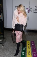PAMELA ANDERSON at Airport in Warsaw 11/24/2017