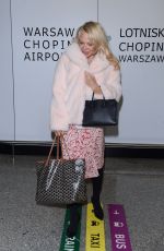 PAMELA ANDERSON at Airport in Warsaw 11/24/2017