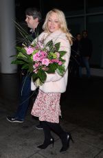 PAMELA ANDERSON at Airport in Warsaw 11/24/2017