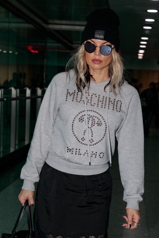 STACY FERGIE FERGUSON at Heathrow Airport in London 11/15/2017