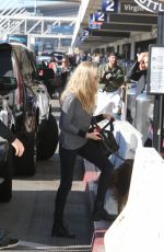 AMANDA SEYFRIED and Her Dog at LAX Airport in Los Angeles 11/27/2017