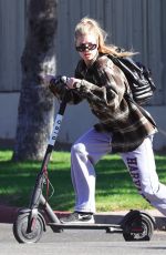 CHARLOTTE MCKINNEY Tides a Bird Scooter in Santa Monica 12/18/2017