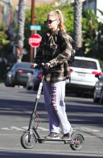 CHARLOTTE MCKINNEY Tides a Bird Scooter in Santa Monica 12/18/2017