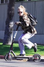 CHARLOTTE MCKINNEY Tides a Bird Scooter in Santa Monica 12/18/2017