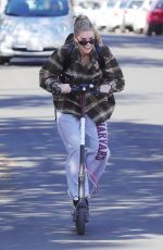 CHARLOTTE MCKINNEY Tides a Bird Scooter in Santa Monica 12/18/2017