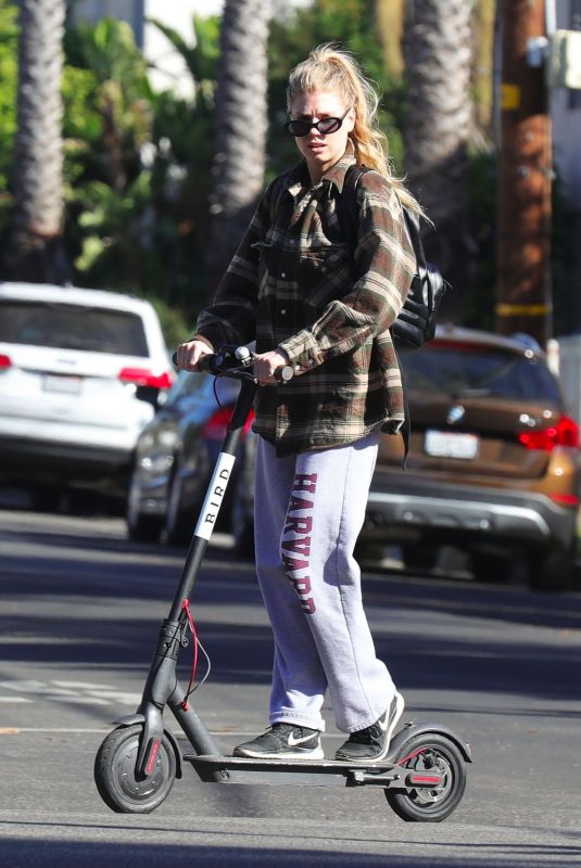CHARLOTTE MCKINNEY Tides a Bird Scooter in Santa Monica 12/18/2017