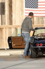 CINDY CRAWFORD and Rande Gerber in Classic Corvette Convertible Driving Out in Malibu 12/23/2017