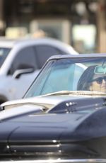 CINDY CRAWFORD and Rande Gerber in Classic Corvette Convertible Driving Out in Malibu 12/23/2017