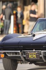 CINDY CRAWFORD and Rande Gerber in Classic Corvette Convertible Driving Out in Malibu 12/23/2017