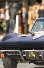 CINDY CRAWFORD and Rande Gerber in Classic Corvette Convertible Driving Out in Malibu 12/23/2017