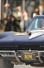 CINDY CRAWFORD and Rande Gerber in Classic Corvette Convertible Driving Out in Malibu 12/23/2017