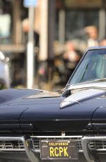 CINDY CRAWFORD and Rande Gerber in Classic Corvette Convertible Driving Out in Malibu 12/23/2017