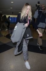 DAKOTA FANNING at LAX Airport in Los Angeles 12/19/2017
