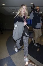 DAKOTA FANNING at LAX Airport in Los Angeles 12/19/2017