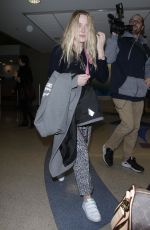 DAKOTA FANNING at LAX Airport in Los Angeles 12/19/2017