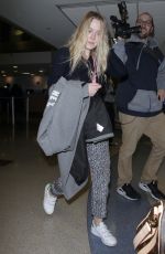 DAKOTA FANNING at LAX Airport in Los Angeles 12/19/2017
