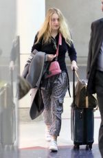 DAKOTA FANNING at LAX Airport in Los Angeles 12/19/2017