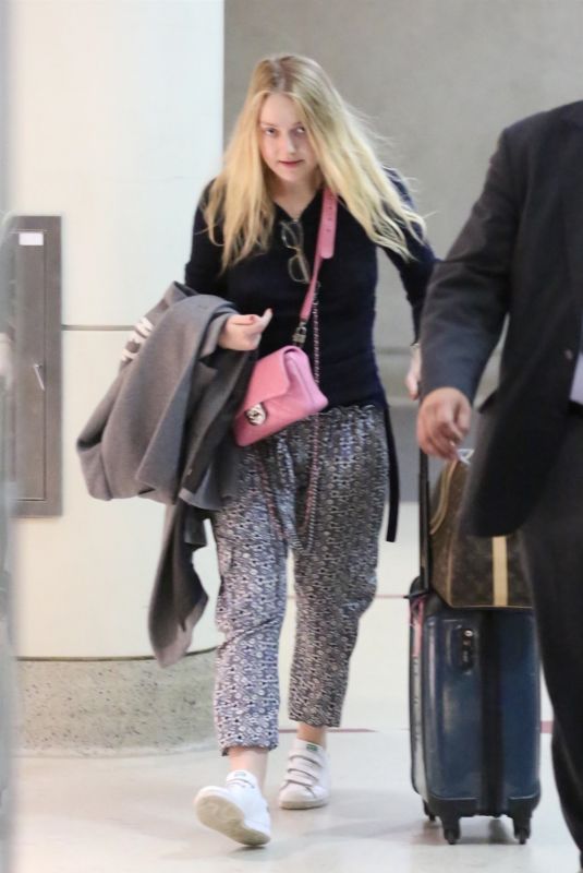 DAKOTA FANNING at LAX Airport in Los Angeles 12/19/2017