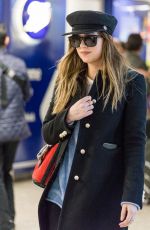 DAKOTA JOHNSON at Heathrow Airport in London 12/14/2017