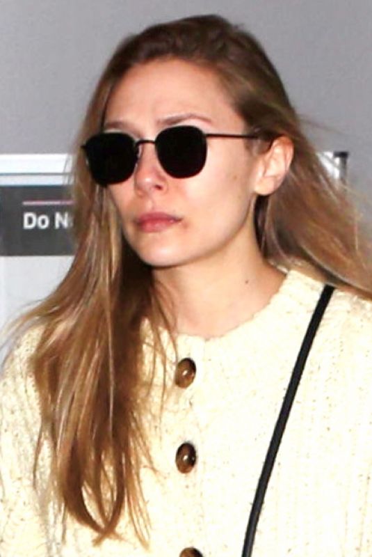 ELIZABETH OLSEN Arrives at LAX Airport in Los Angeles 12/01/2017