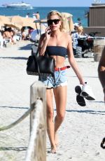 HAILEY BALDWIN in Bikini Top at a Beach in Miami 12/29/2017