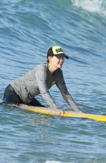 HELEN HUNT in Bikini Top Surfing in Hawaii 12/19/2017