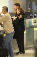 HILARY SWANK and Philip Schneider at LAX Airport in Los Angeles 12/17/2017