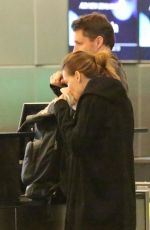 HILARY SWANK and Philip Schneider at LAX Airport in Los Angeles 12/17/2017