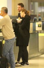 HILARY SWANK and Philip Schneider at LAX Airport in Los Angeles 12/17/2017